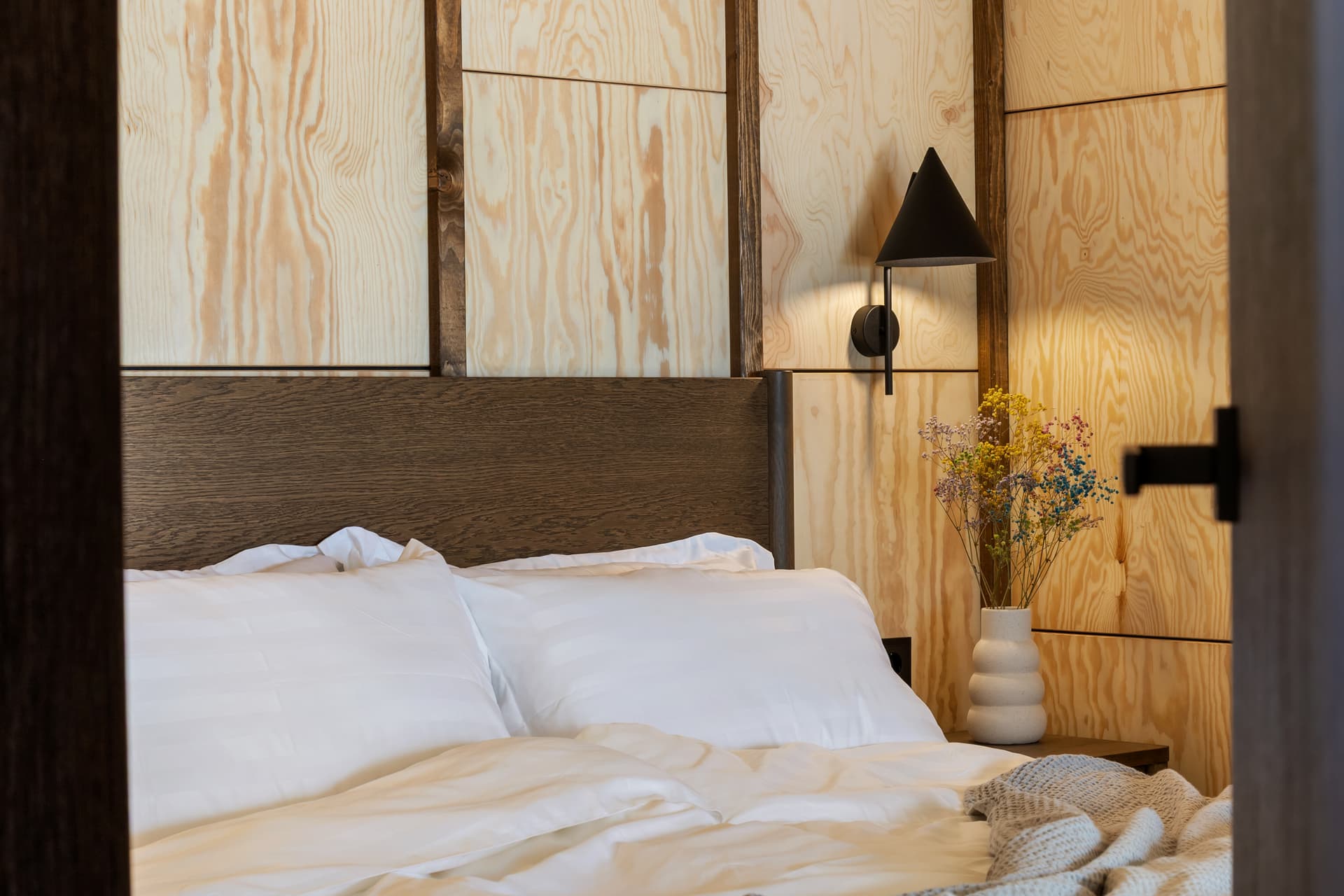 Bedroom pillows and dried flowers